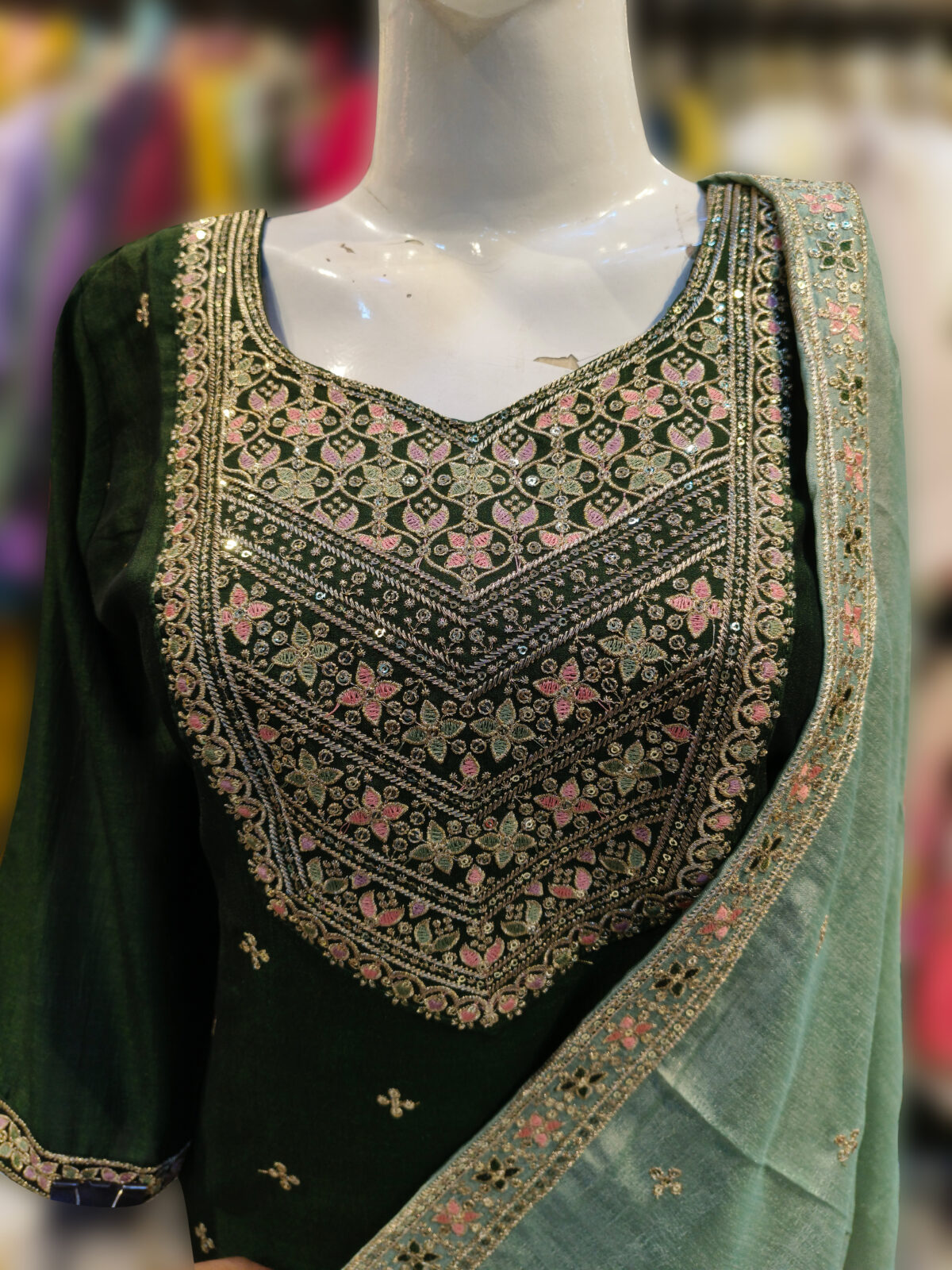 3-Piece Suit Featuring Vichitra Fabric With Intricate Aari Work Or Thread Work, Paired With A Sequence Work Contrast Dupatta And Matching Bottom, Complemented By A Designer Potli.